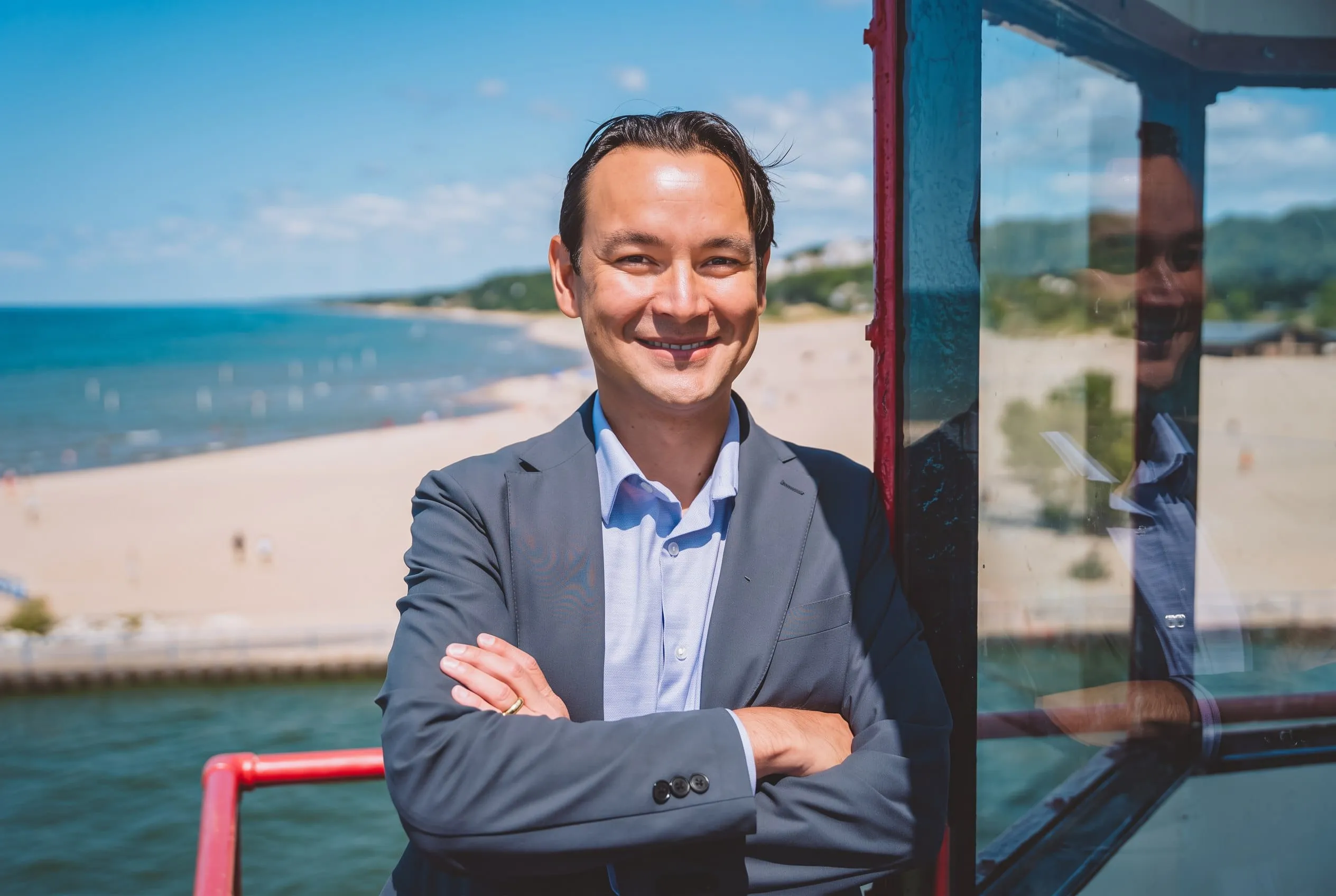 Charles Elwood in Holland, Michigan, with Lake Michigan in the background